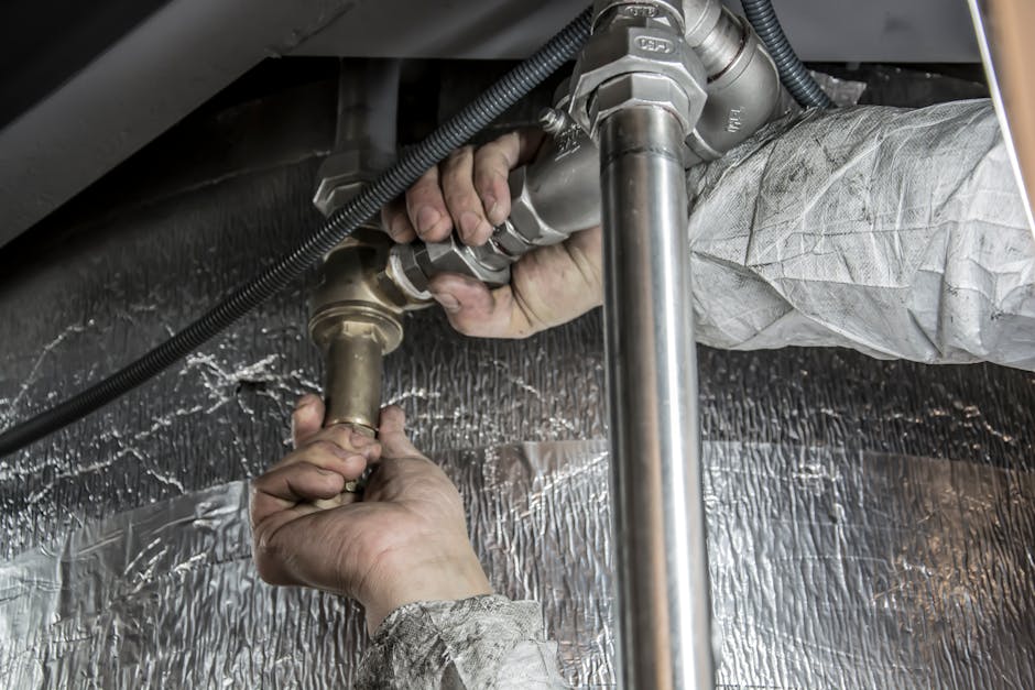 Shoreline Plumber Repairing Clogged Drain Pipe