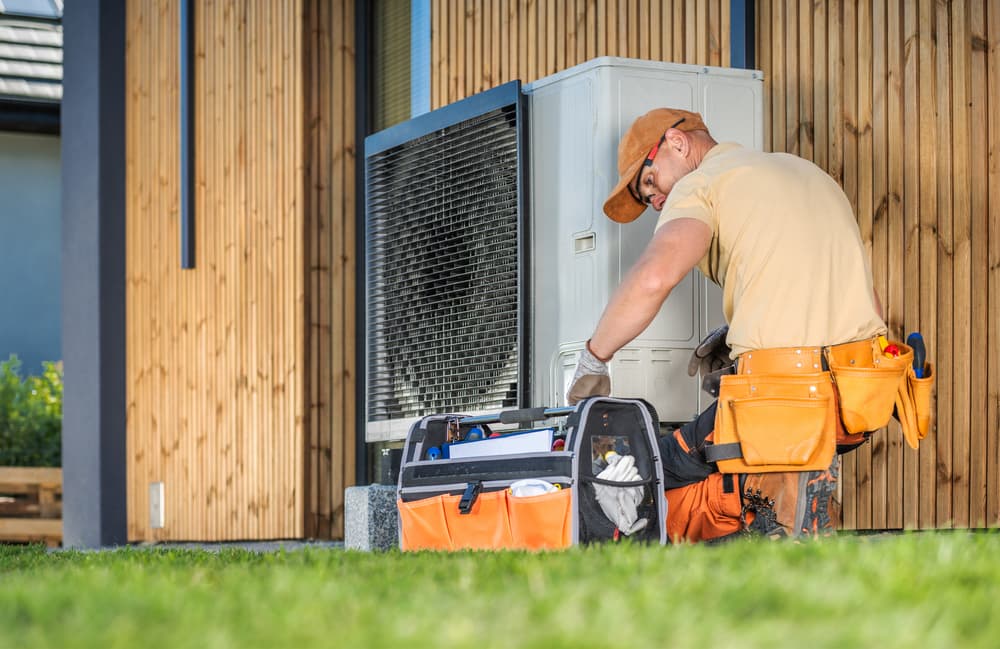 HVAC Technician Fixing Heat Pump
