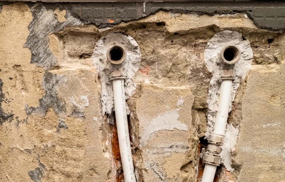old water supply with metal plastic pipes