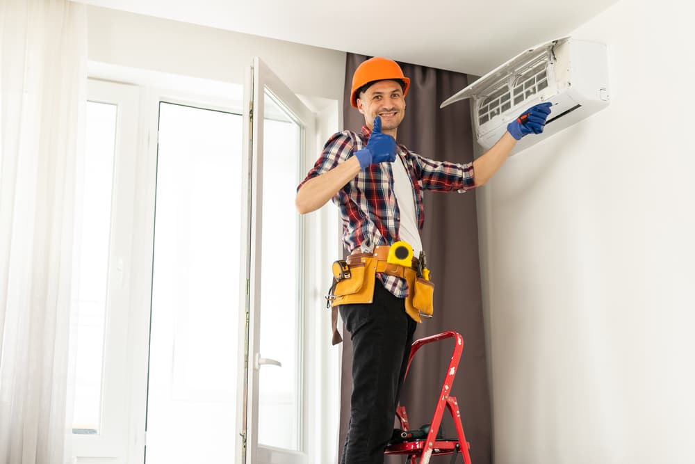 Technician Maintaining Mini Split AC